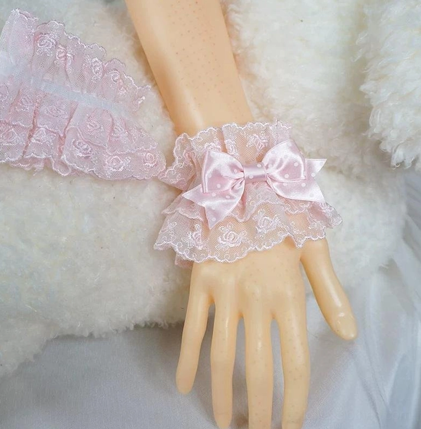 pink sweet lolita plain lace wrist cuff on mannequin hand side view with ruffled edge and solid rose pattern embroidery no pendant