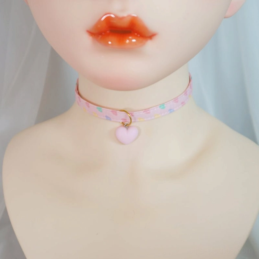 Minimalist solid light pink lolita choker with gold jump ring and matte pink heart pendant worn on BJD mannequin simple design