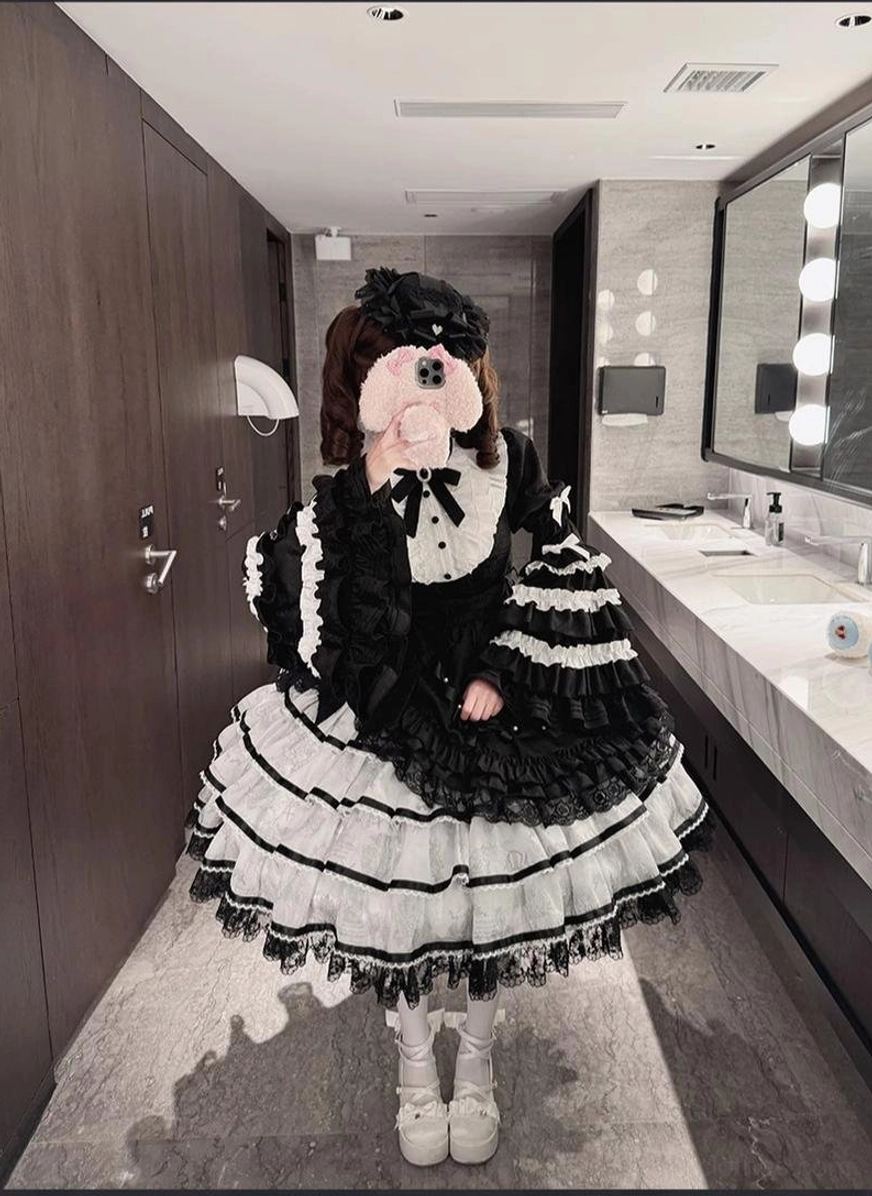 Sweet lolita OP dress close-up showing jacquard fabric quality weave texture premium material construction detail shot