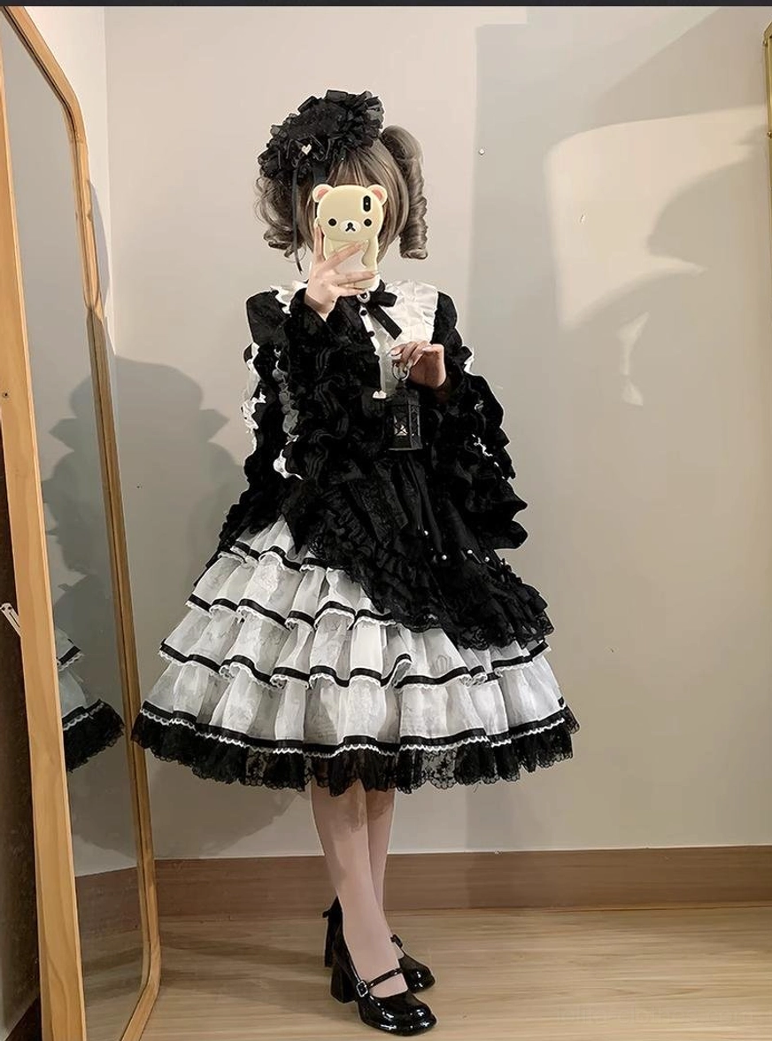 Solo puppet sweet lolita OP dress paired with matching colored lace parasol and hair accessories outdoor garden setting modeling complete ensemble