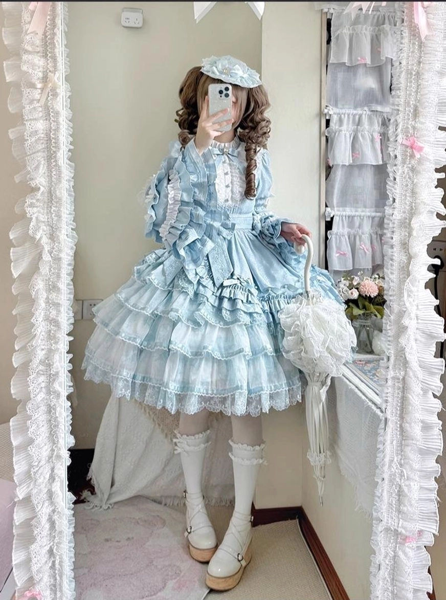 Sky blue solo puppet sweet lolita OP dress back three-quarter view indoor room scene curly twin hair lolita blue beret holding lace parasol multi-layered tiered ruffled lace skirt princess sleeves
