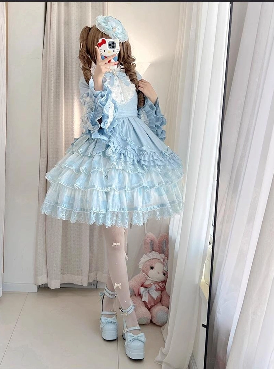 Sweet lolita OP dress tiered ruffled skirt detail multi-layer lace trims tulle fabric close-up shot showing ruffle construction A-line silhouette foundation