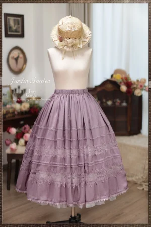Spring Whispers dusty purple classic Lolita long skirt with multi-tiered lace detailing, elasticated waist, and scalloped hem, styled on dress form with vintage straw hat in retro studio setting