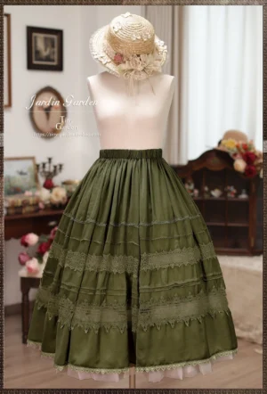 Olive green classic Lolita long skirt featuring embroidered lace tiers, full A-line silhouette with ruffled underskirt hem, elasticated waist design, displayed on dress form with floral straw hat