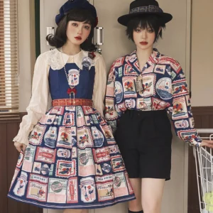 Matching coordinate sets featuring stamp print jumper skirts and blouses worn by two models in vintage Lolita styling