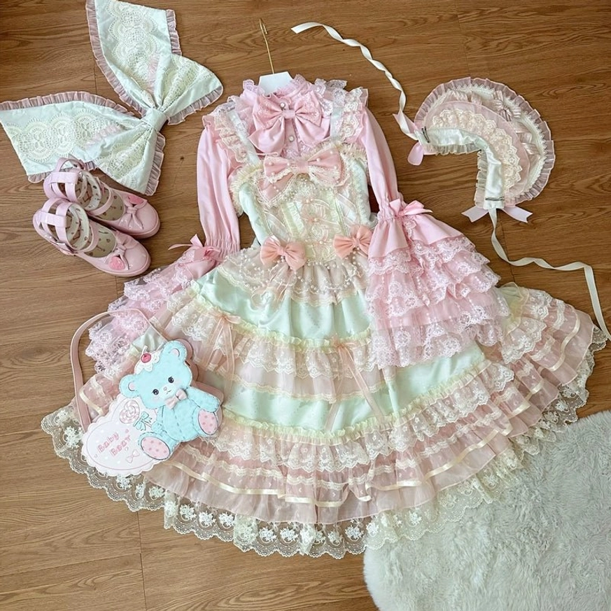 Star Love Song sweet lolita coordinating blouse pink version with tiered ruffles, princess-cut puff sleeves, and delicate bow neckline
