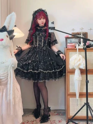Red-haired model wearing Starlight Nocturne classic lolita JSK with matching lace veil, black stockings and platform heels, full body front portrait