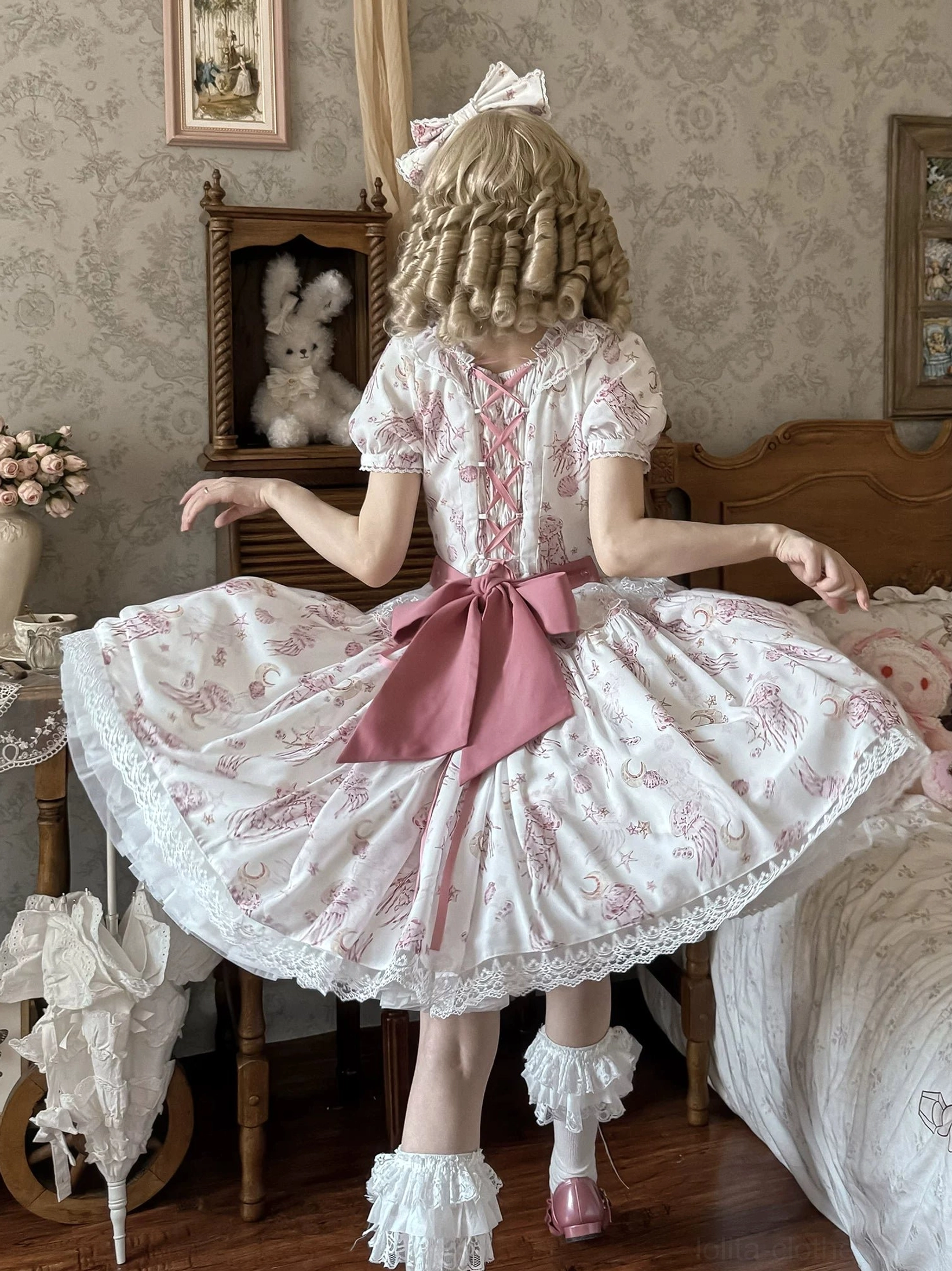 Starry jellyfish classic lolita short-sleeve OP dress back view light pink base large back bow lace hem trim celestial print