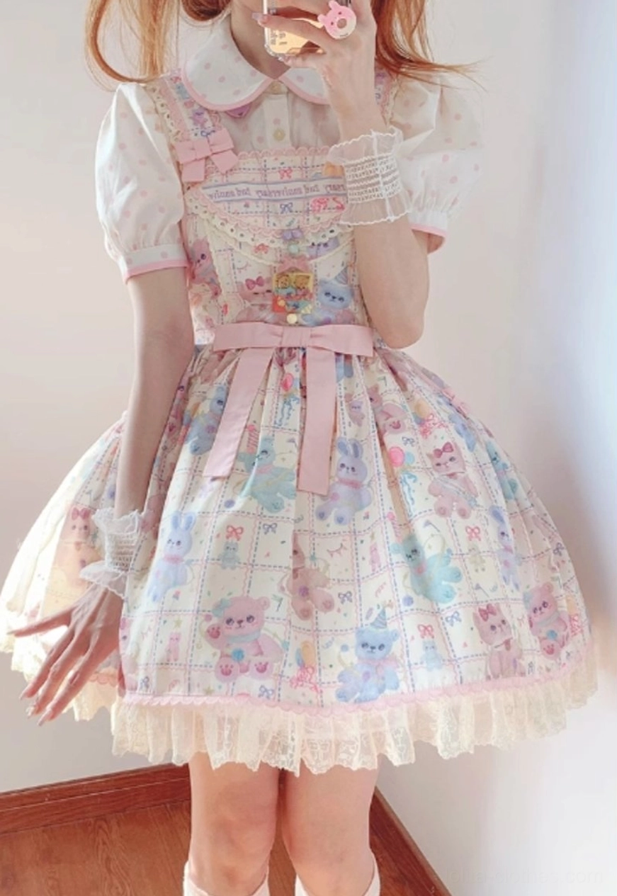 Model wearing starry pudding bear sweet lolita dress with peter pan collar white knee-high stockings and pink waist bow