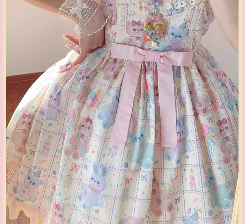 Close-up detail of starry pudding bear sweet lolita dress large pink waist bow scalloped lace hem and animal print