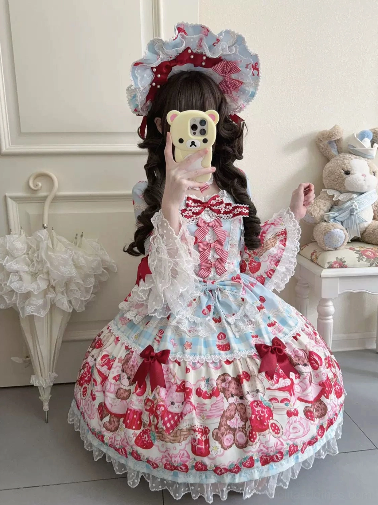 Strawberry bear lolita one-piece dress skirt ruffle construction detail showing layered lace, print placement, hem design, and voluminous silhouette creation