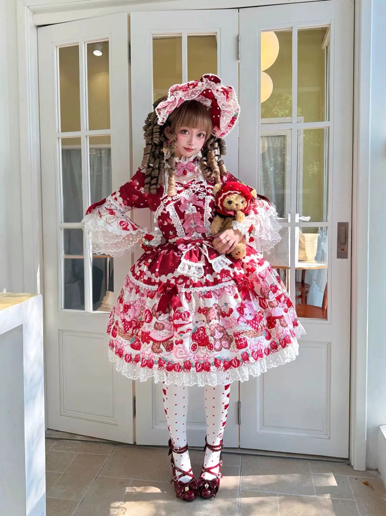 Sweet lolita OP dress full-body side view on mannequin displaying silhouette, hime sleeves, waist bow placement, ruffled skirt volume, and overall proportions