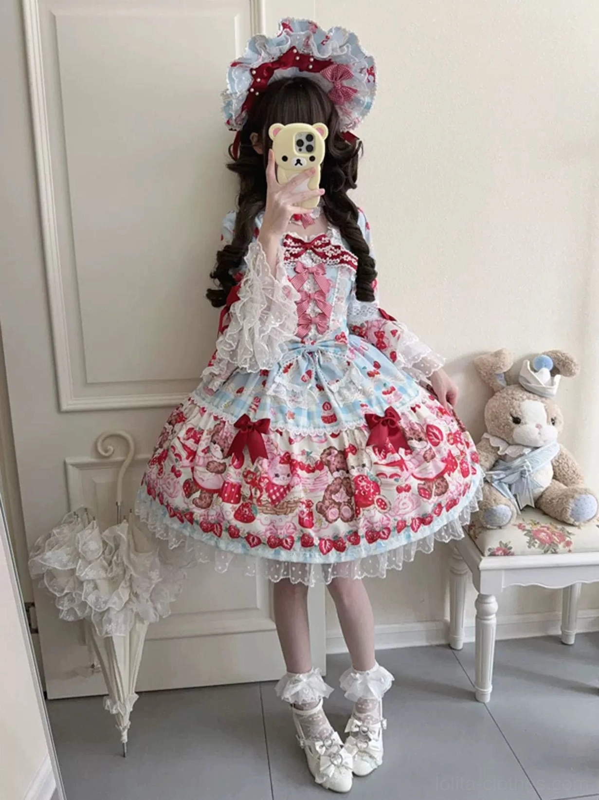 Sweet lolita OP dress front neckline detail showing square neckline construction, bow embellishment, delicate lace trim, and print pattern coordination