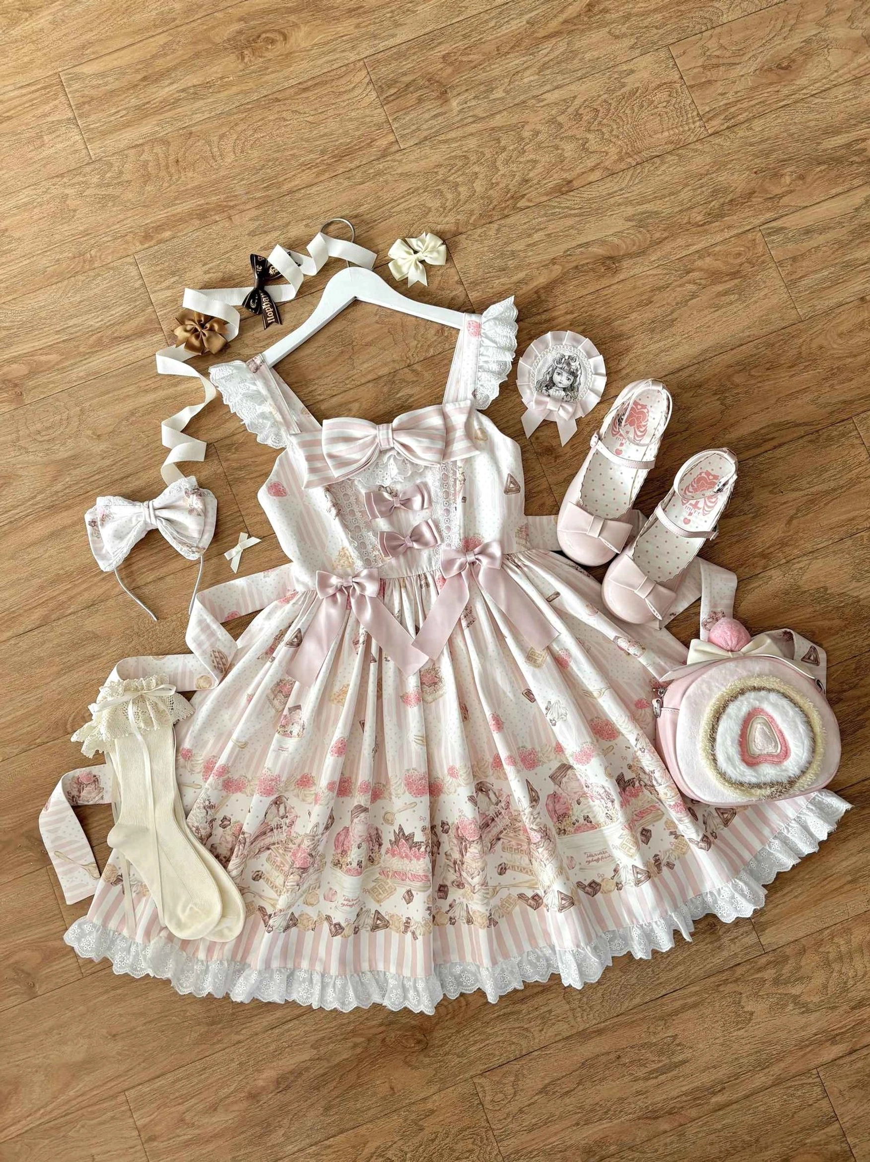 Complete Iced Strawberry Cheese Lolita coordinate flat lay wooden floor background JSK dress matching hair bows clips ruffled socks shoes heart-shaped handbag full ensemble
