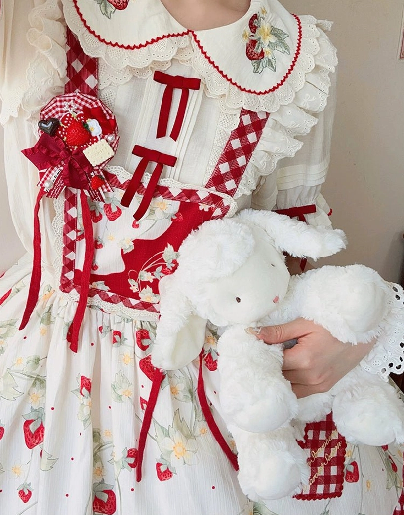 Close-up front upper body of girl wearing strawberry sweet lolita blouse with delicate strawberry embroidery on Peter Pan collar holding white stuffed rabbit toy