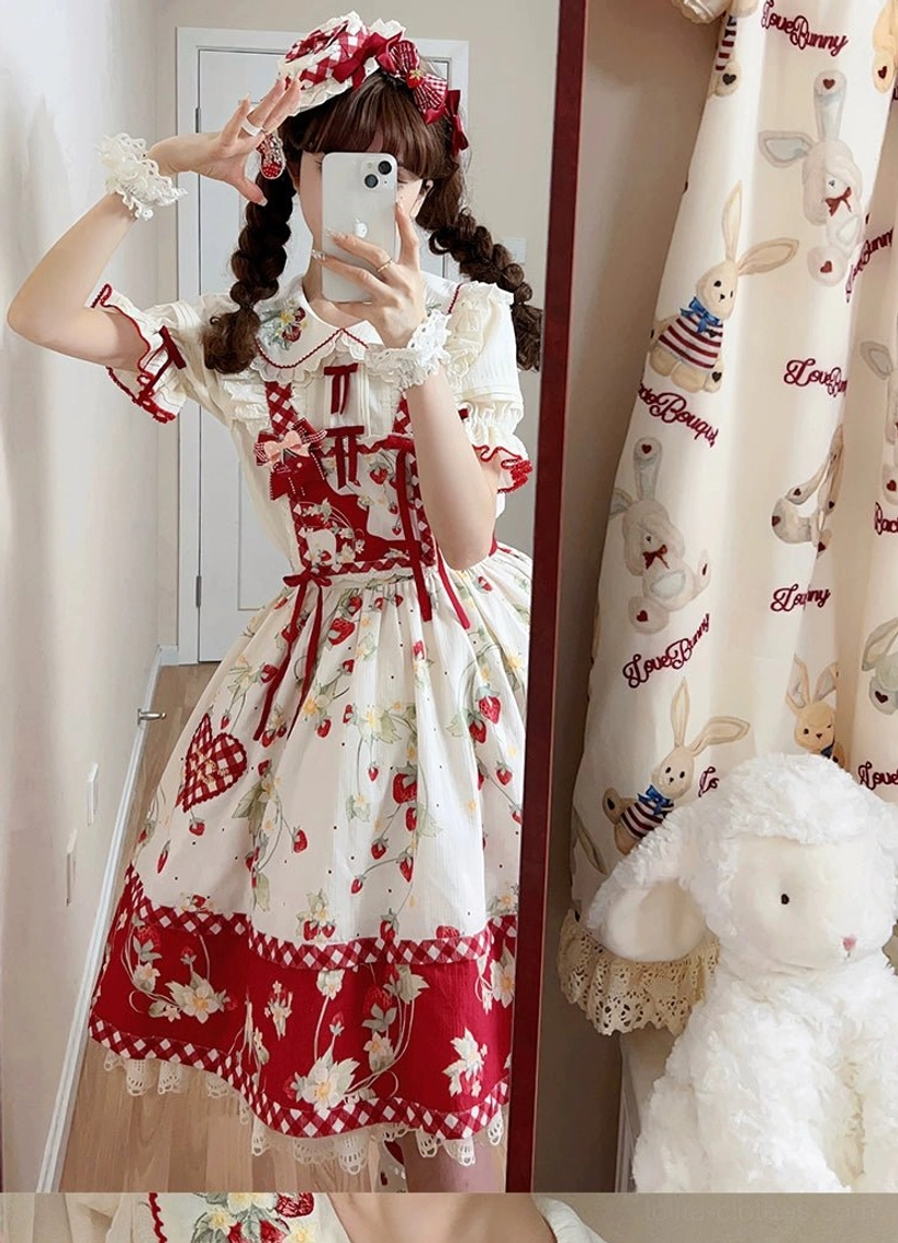 Side profile view of girl wearing ivory strawberry sweet lolita blouse showing Peter Pan collar silhouette and sleeve proportion
