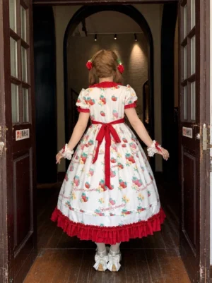 Strawberry Lolita OP dress back view showcasing long red waist bow ruffled hem and all-over strawberry pattern design rear styling detail