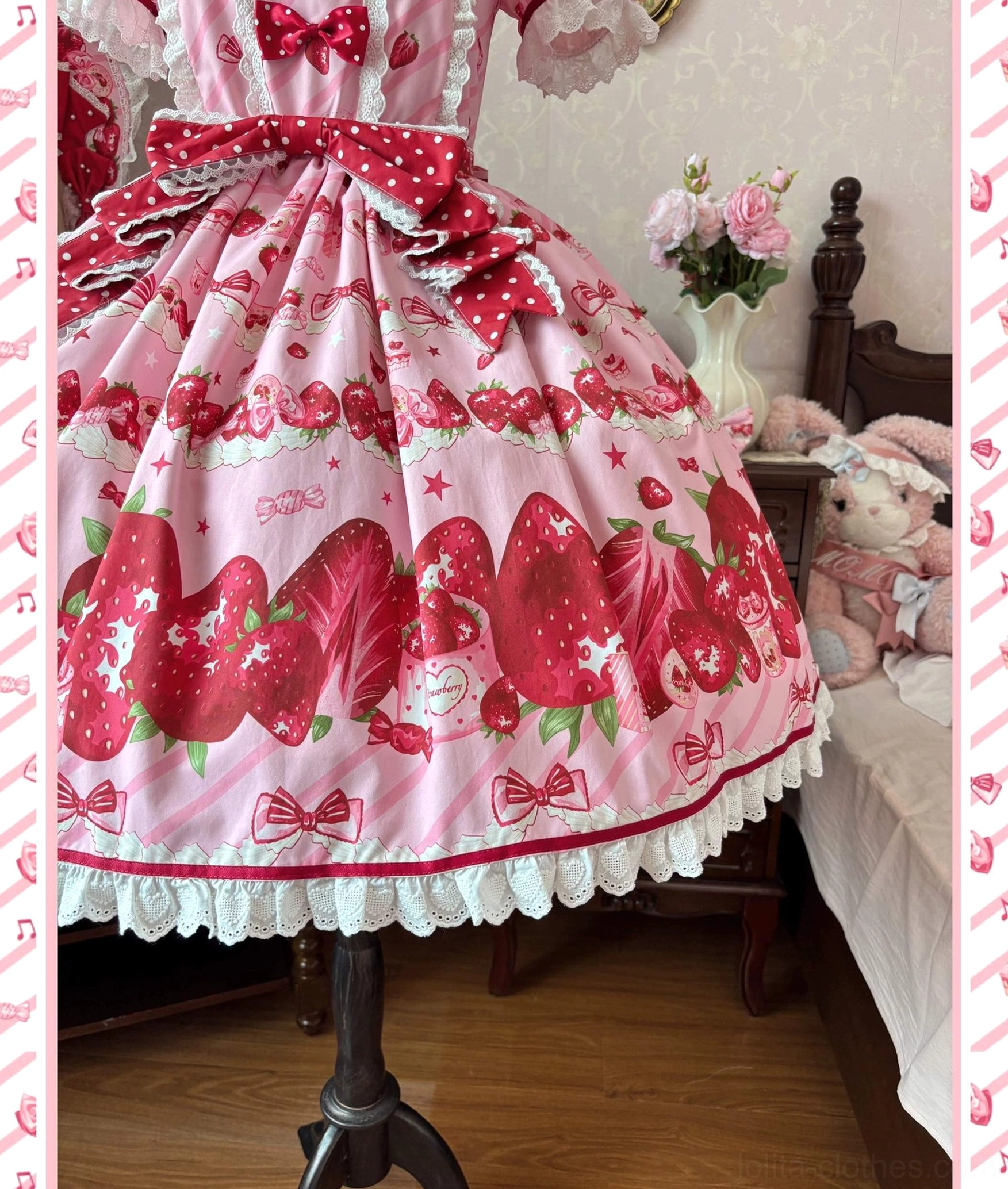 Close-up detail shot strawberry lolita dress waist and skirt section oversized red strawberry prints ribbon bow accents ruffled white lace hem trim texture