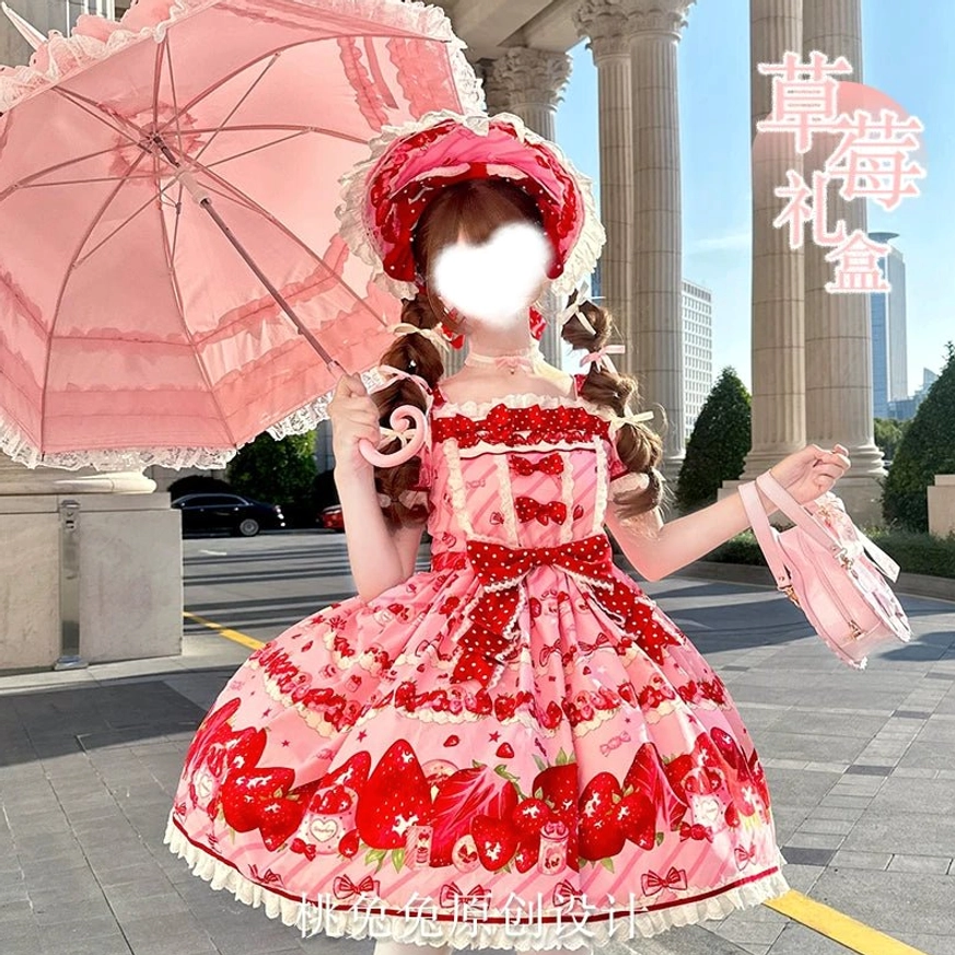 Strawberry sweet lolita OP dress worn on model front full view European outdoor street setting with red lace bonnet pink umbrella matching handbag classic lolita silhouette