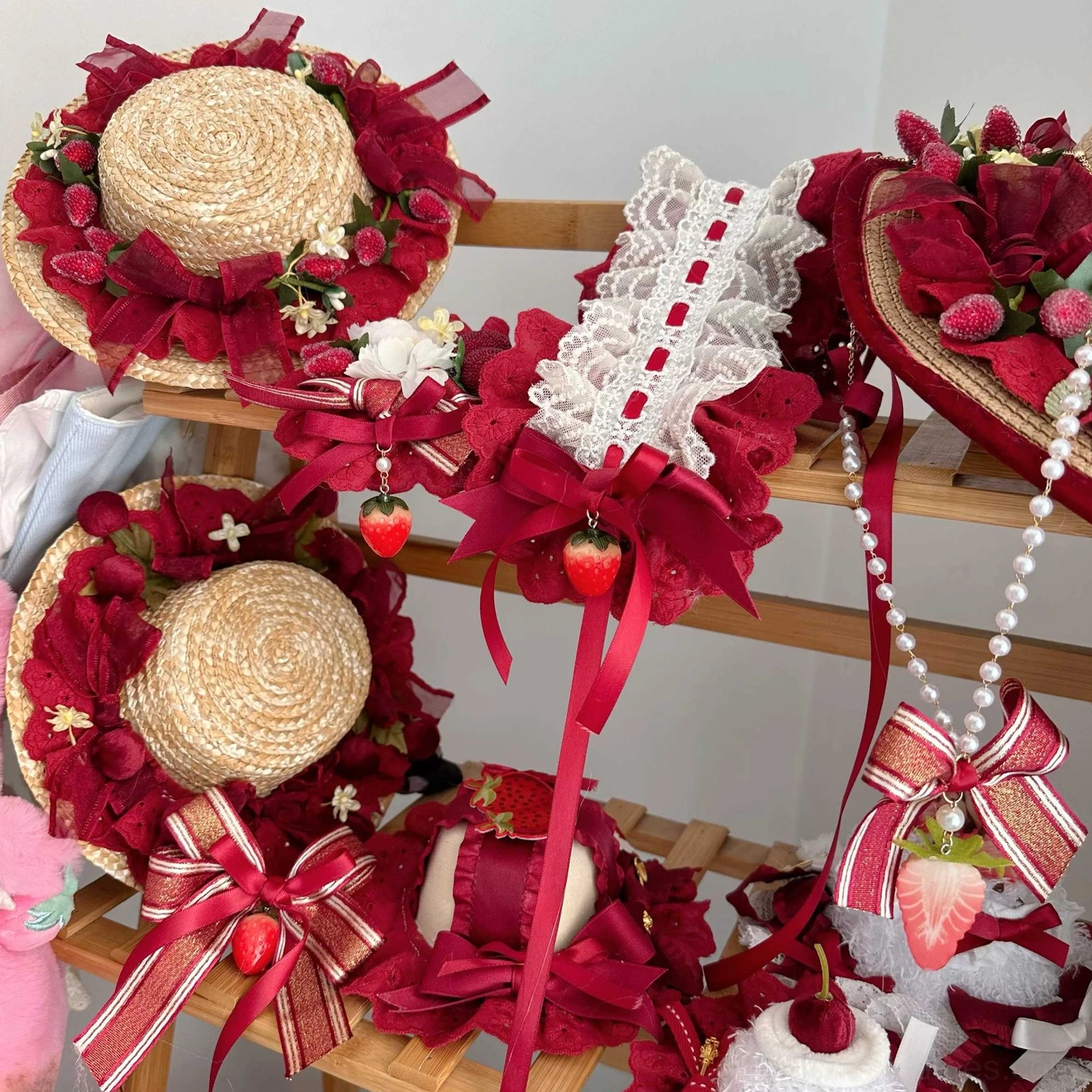 Multiple strawberry lolita hair clip and bow accessory variations showing different styles and configurations