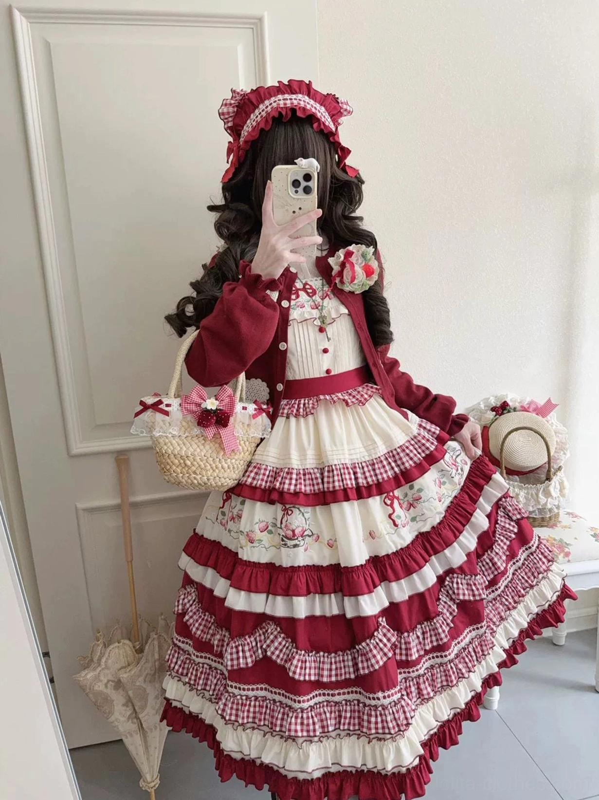 Country lolita JSK dress with matching bonnet strawberry basket handbag worn by model in indoor setting mirror selfie