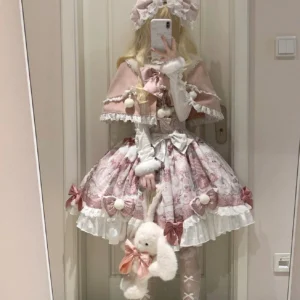 Sweet lolita girl wearing strawberry pink JSK dress with capelet set blonde curly hair white gloves plush rabbit accessory mirror selfie