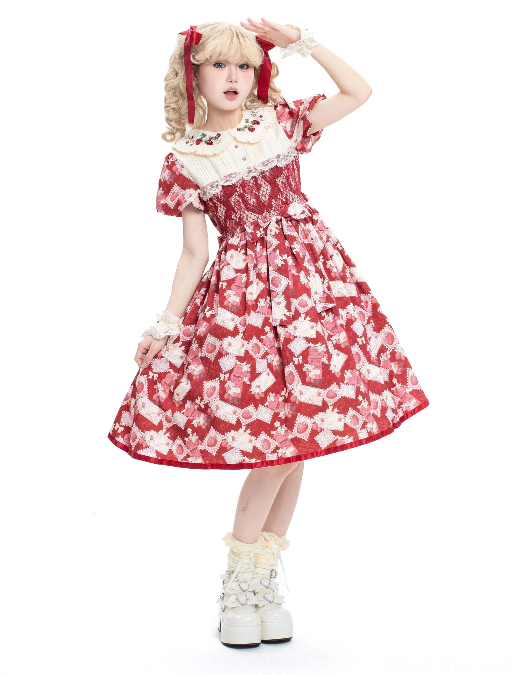 Lolita OP strawberry dress side-three-quarter view showcasing shirred elastic bodice, flowy A-line midi silhouette, white lace collar trim, model wearing white platform boots