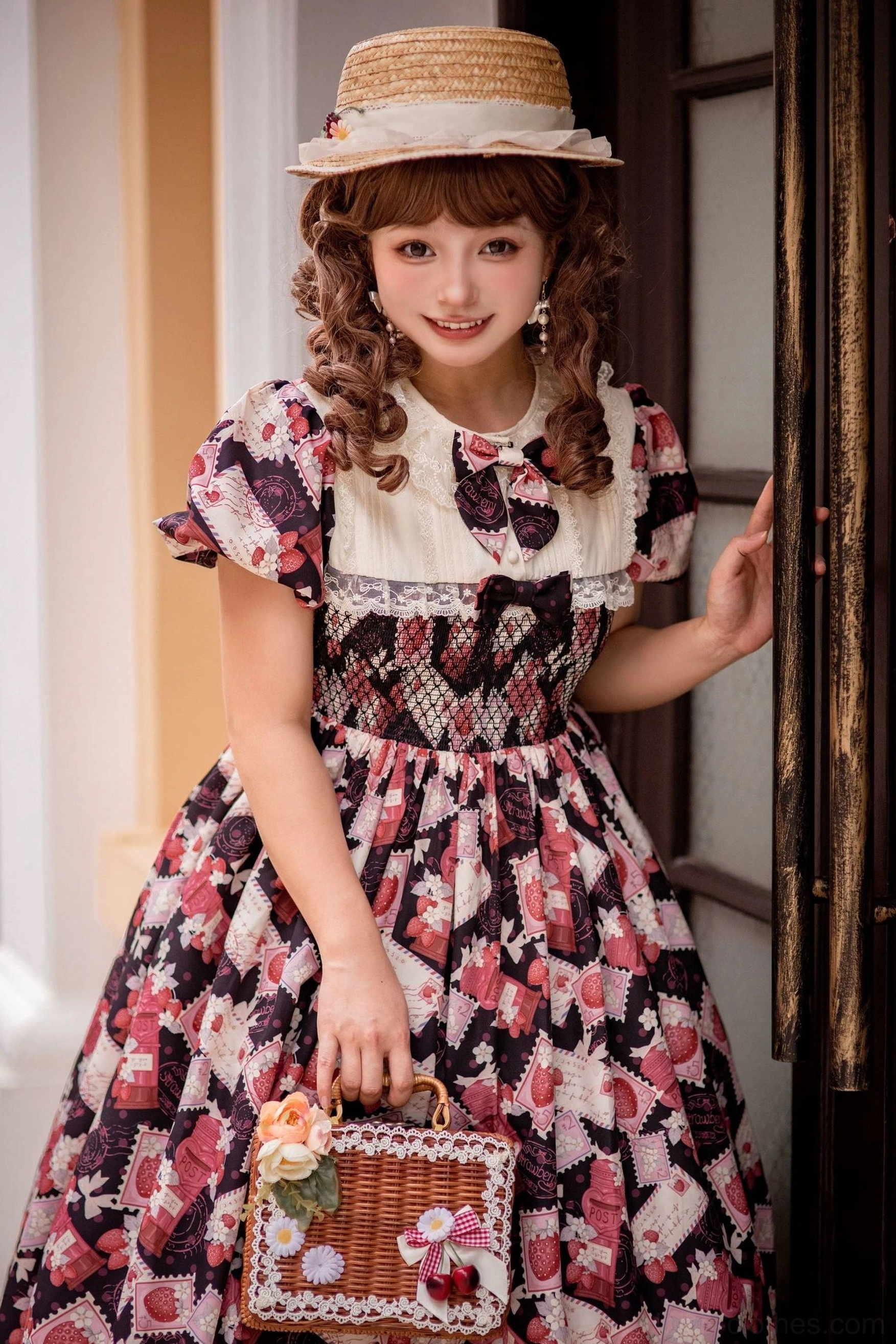 Red and pink strawberry Lolita OP dress side-by-side comparison showing color vibrancy, print clarity, design consistency across both colorway options