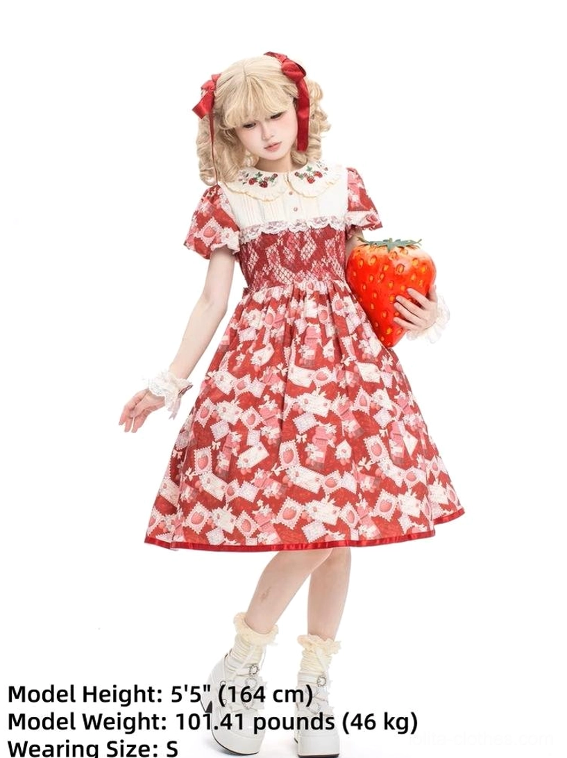 Strawberry print Lolita one-piece dress modeled by size S wearer at 5'5" height showing fitted proportions, white ruffled Peter Pan collar, red hem binding, tied waist detail, authentic sweet lolita silhouette