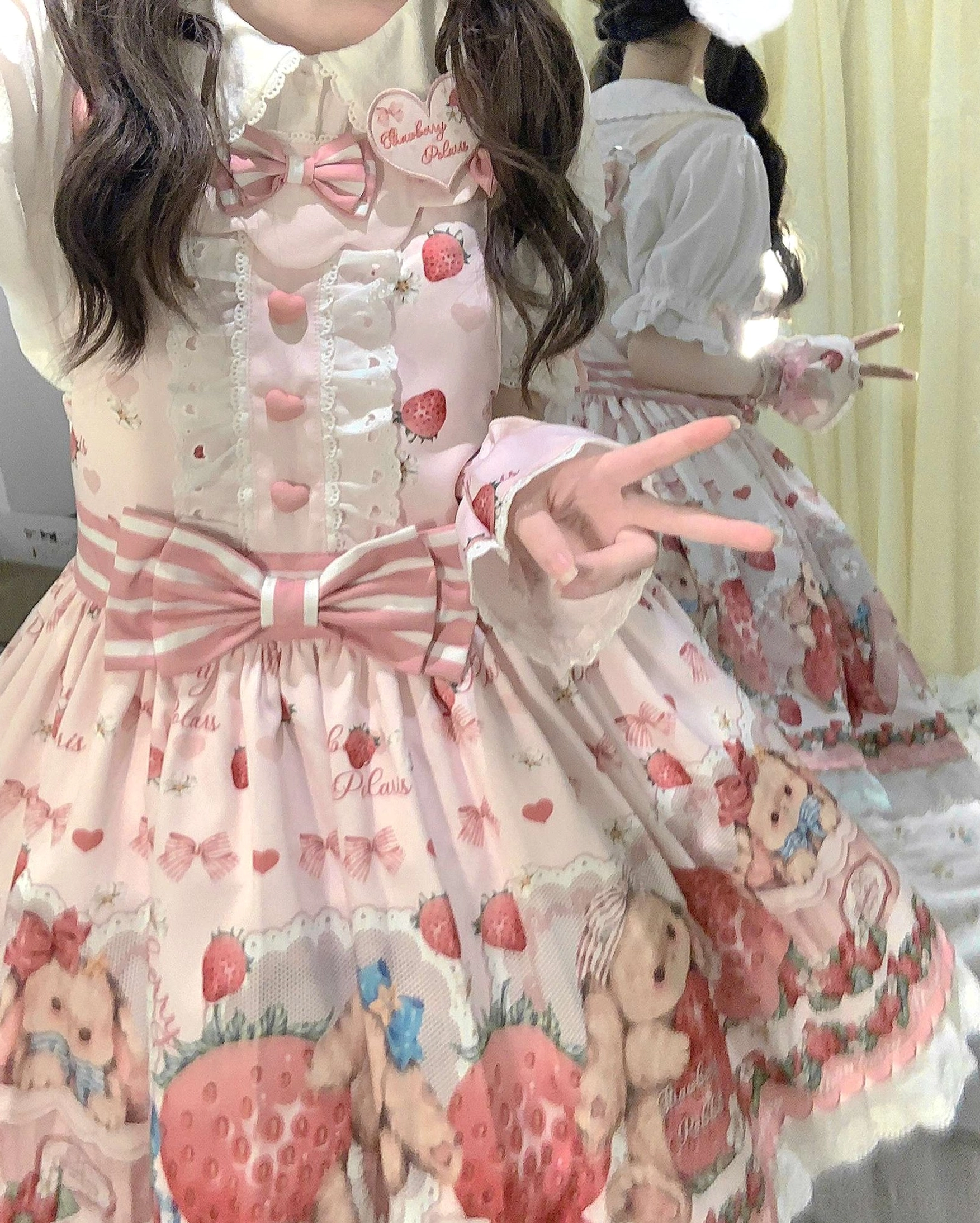 Strawberry rabbit sweet lolita salopette heart buttons and bow details close-up showing romantic embellishment quality