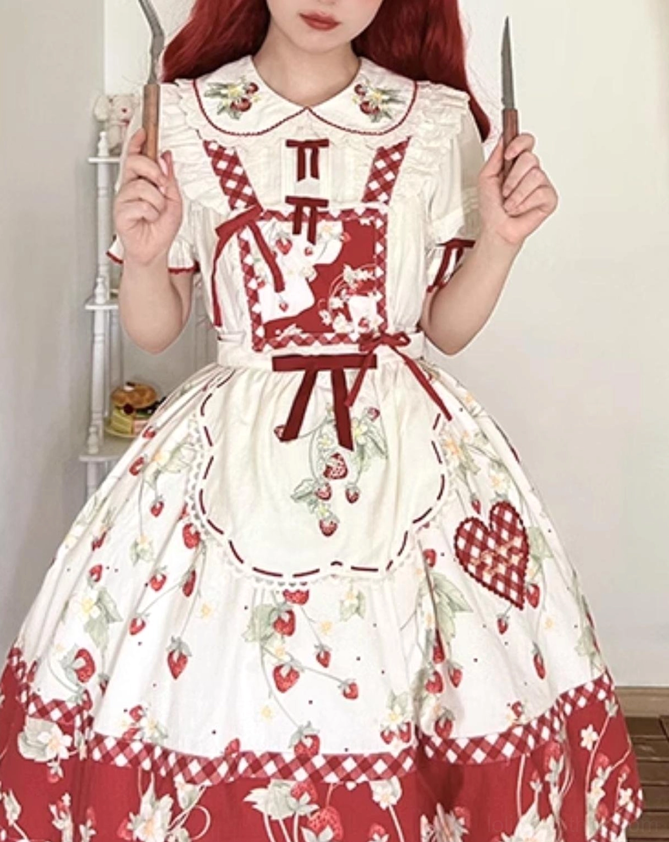 Ivory sweet lolita blouse with strawberry embroidery and removable red bows styled with matching accessories coordinated outfit display