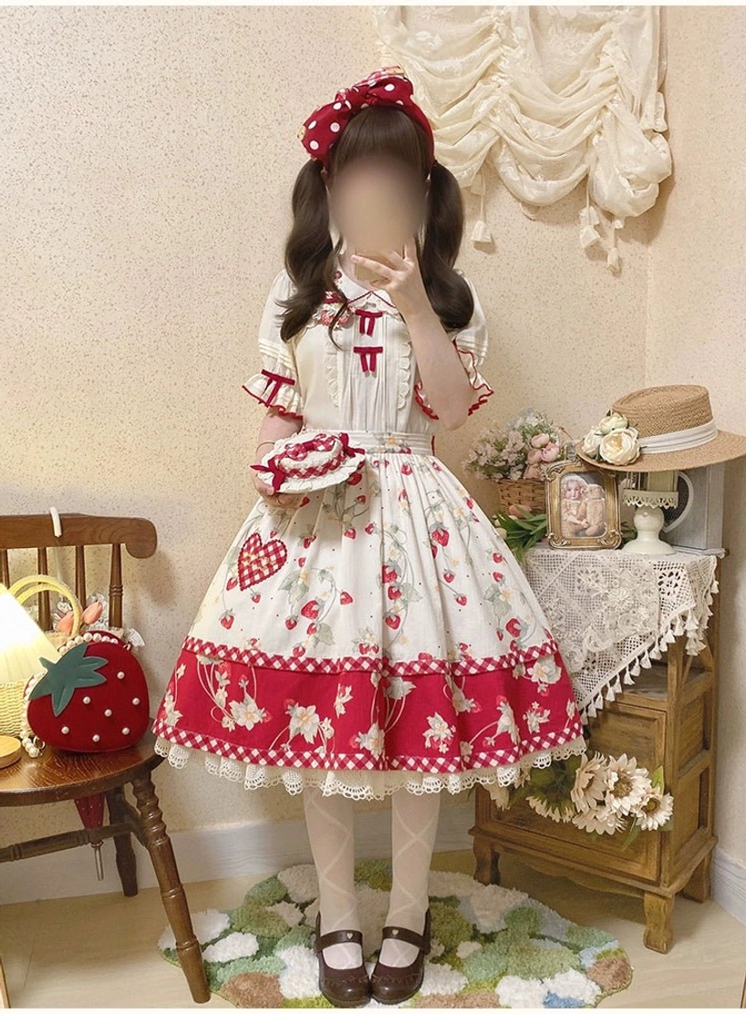 Mannequin styled with complete strawberry sweet lolita coordinate featuring ivory blouse with Peter Pan collar paired with matching skirt and accessories