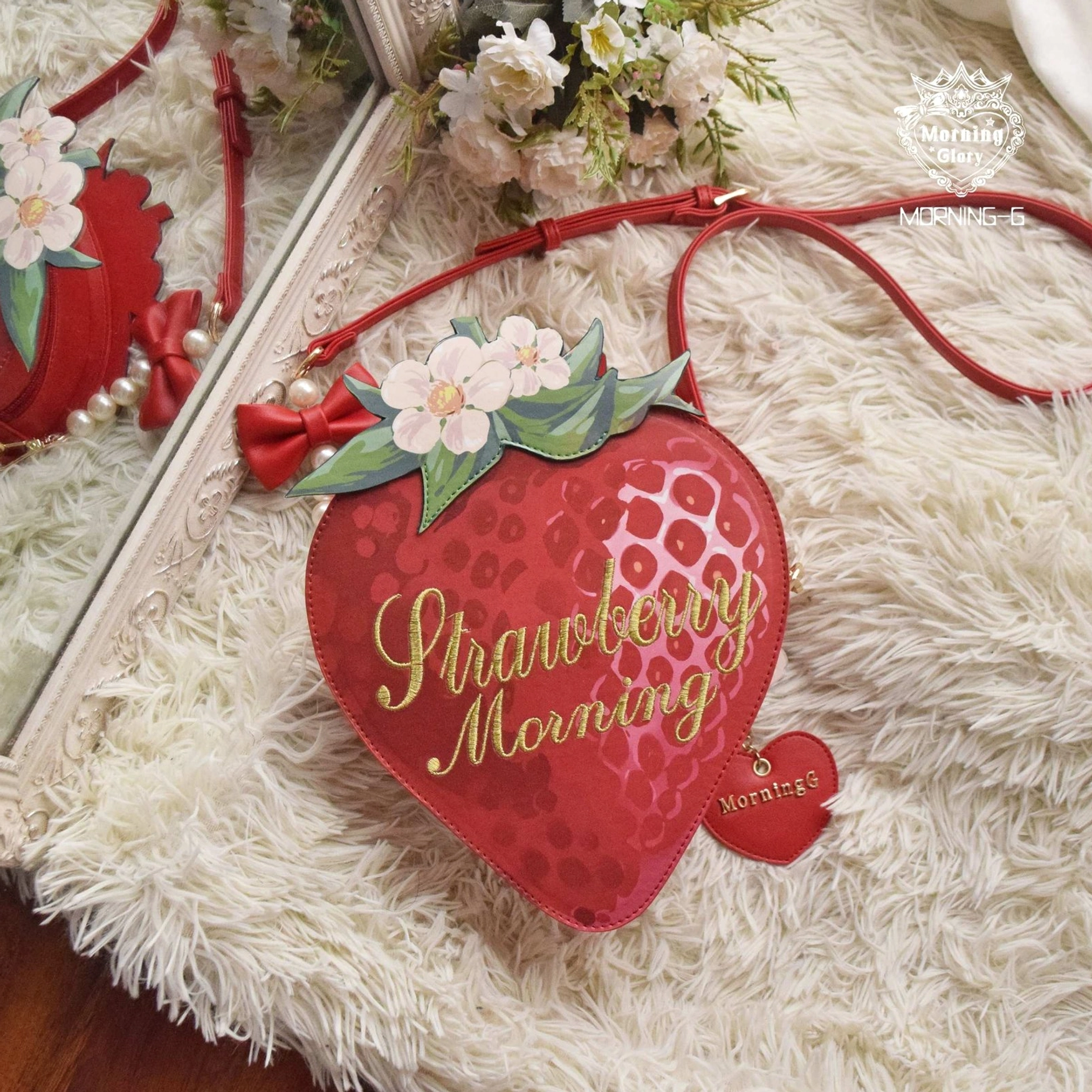 Strawberry sweet lolita crossbody bag flat lay with golden embroidery text and floral decorations on beige carpet