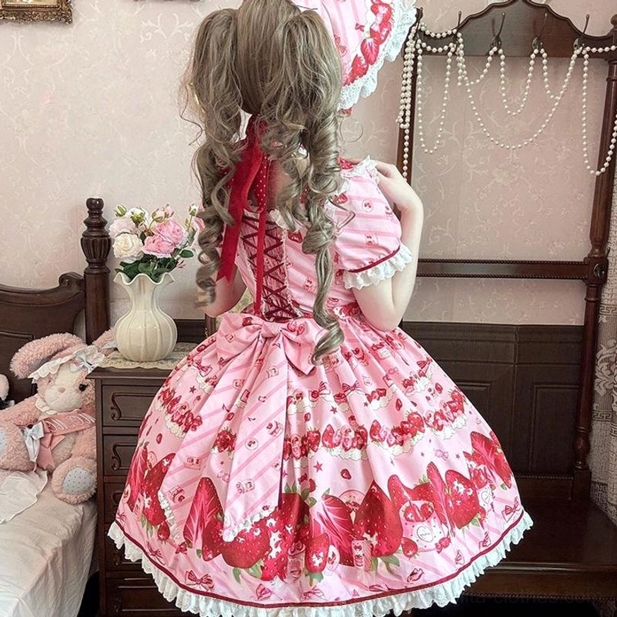 Strawberry lolita one-piece dress back view showing lace-up corset back design large red waist bow and tiered skirt hem with red fabric trim