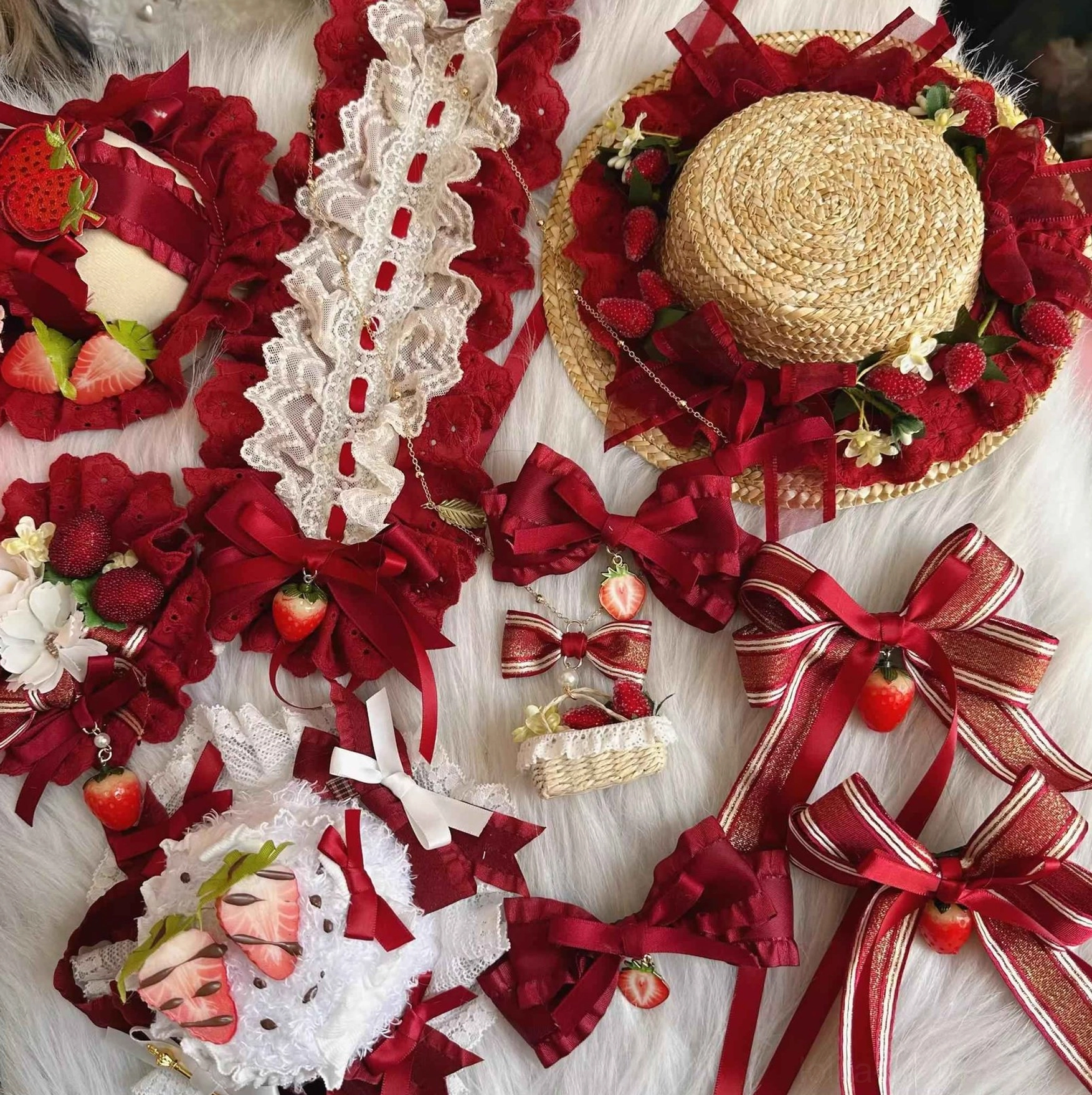 Assorted strawberry sweet lolita headdress accessories collection flat lay featuring wine red satin bows lace trims and faux strawberry decorations