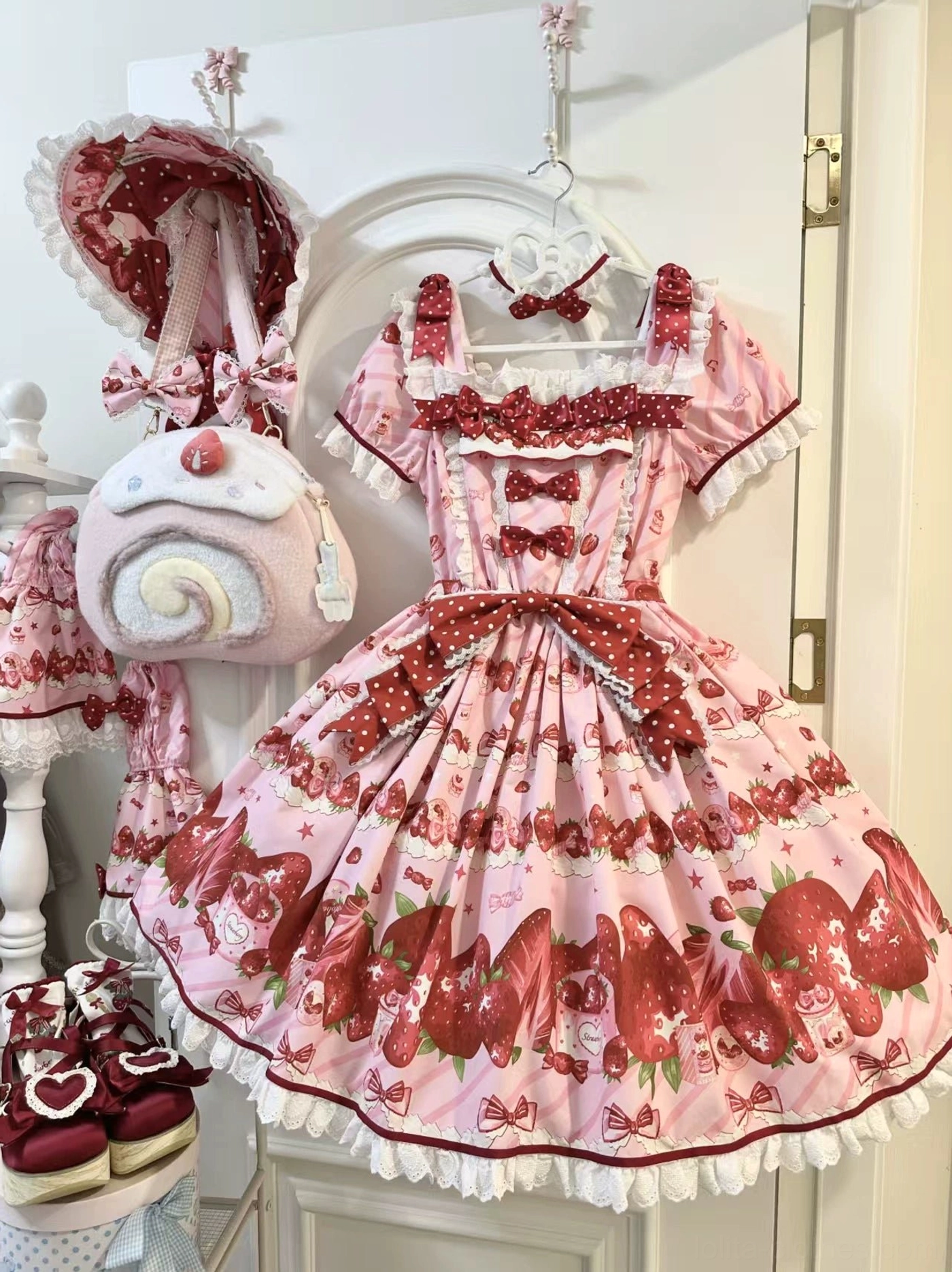 Strawberry sweet lolita OP dress with bonnet and headbow accessory detail white lace trim pink strawberry print full ensemble coordination showcase