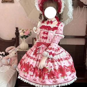Strawberry sweet lolita OP dress front full view worn on model in vintage bedroom with pink base fabric red strawberry print lace ruffled trims and bow decorations