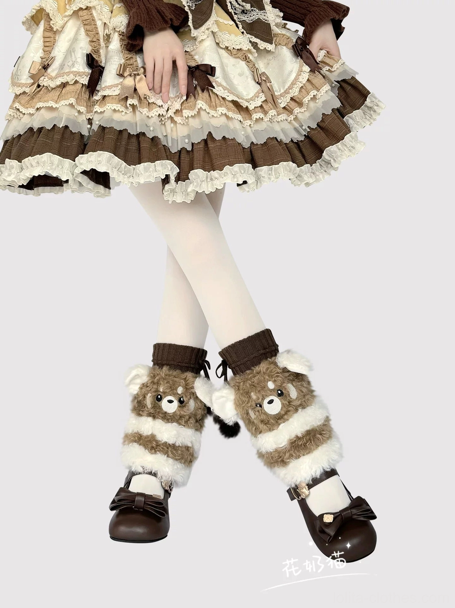 Striped plush bear leg warmers low front view with crossed lower legs on model in frilly Lolita dress white tights brown bow shoes
