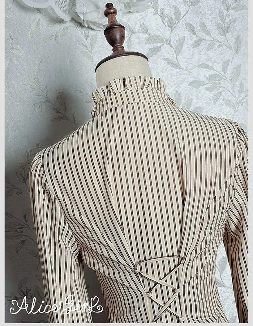 Striped lolita blouse styled with gothic-themed coordinate showing alternative aesthetic application