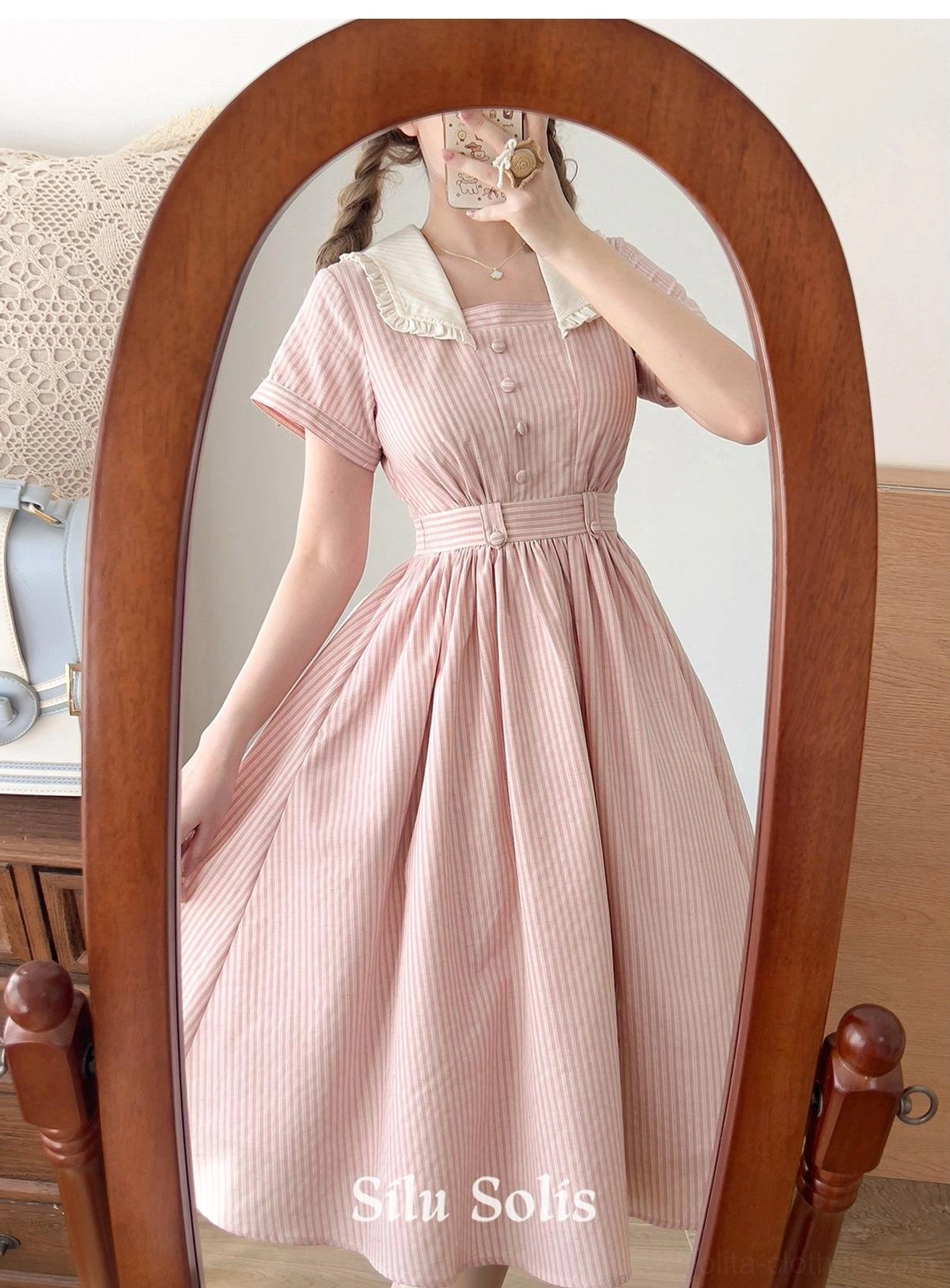 Color comparison shot showing both blue and pink variations of the striped classic Lolita OP dress side by side on mannequins for style selection