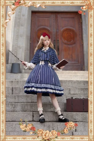 lolita coordinate featuring light-blue striped jumper skirt capelet and white blouse with magical accessories on church steps