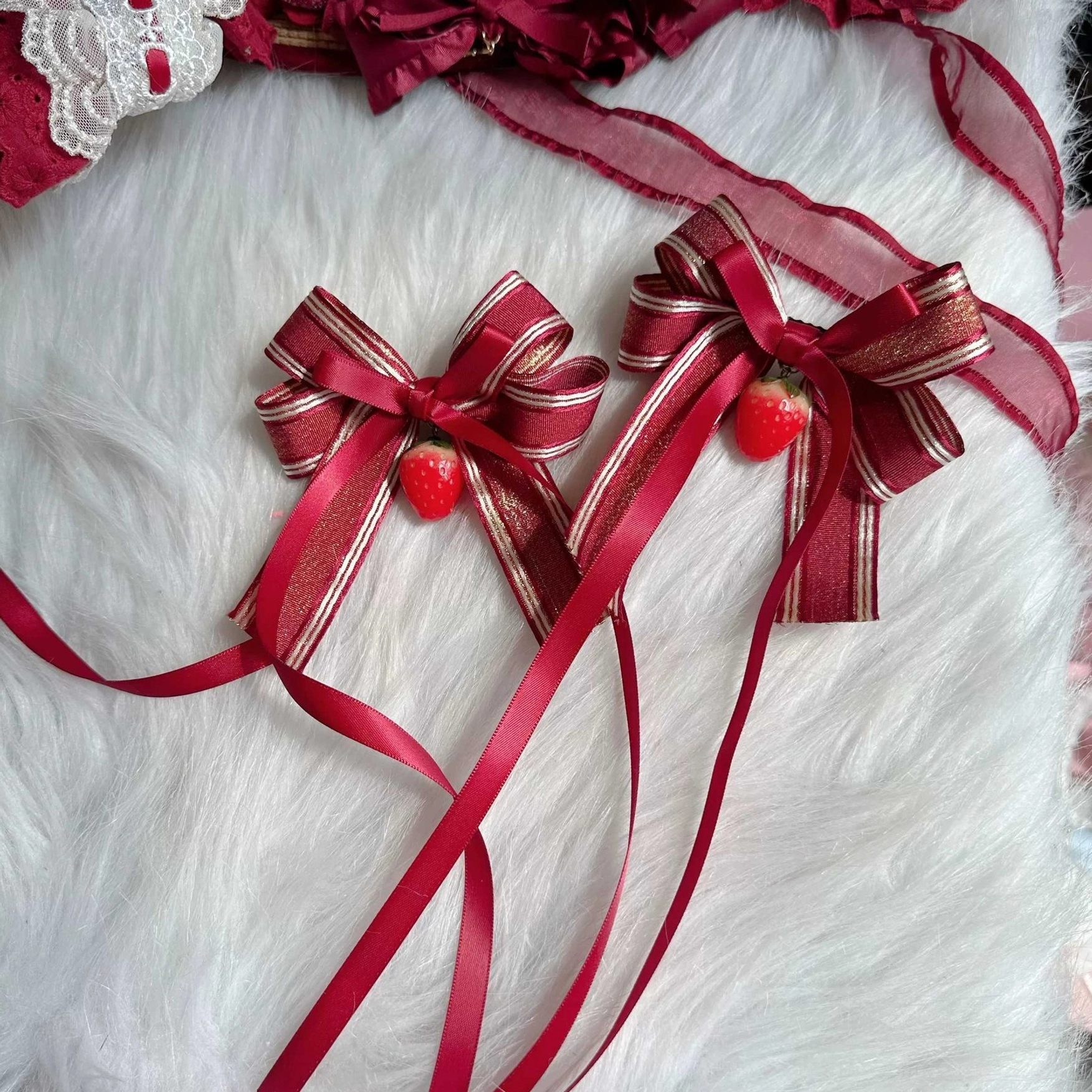 Pair of striped satin bow lolita hair clips with gold striped wine red bows long ribbons and strawberry pendants