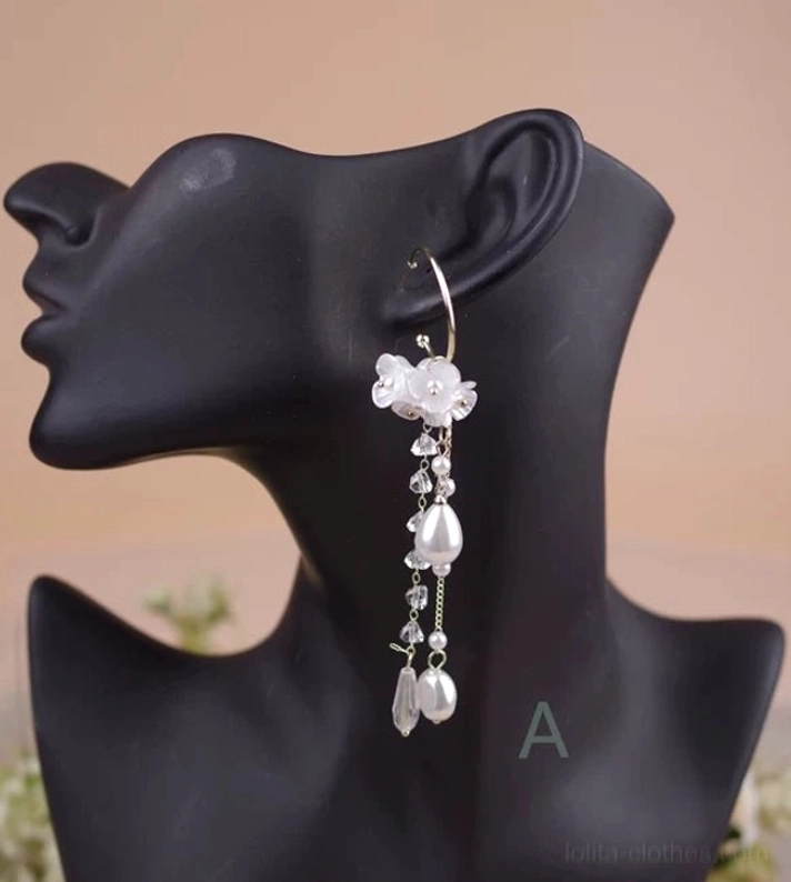 Classic Lolita Style A faux flower pearl rhinestone dangle earring close-up detail view showing gold hoop post clustered white flower petals layered artificial pearls and teardrop pearl drop tassel