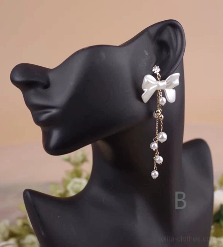 Style B Classic Lolita white bow pearl rhinestone dangle earring stud post worn on ear mannequin side view showing satin bow rhinestone accent and graduated pearl chain tassels