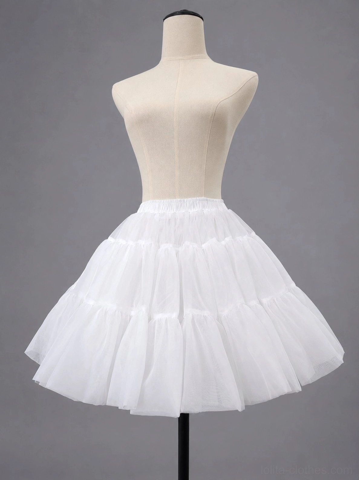White sugar puff petticoat side three-quarter view on dress form showing neat tiered tulle ruffles full voluminous skirt silhouette elastic waist