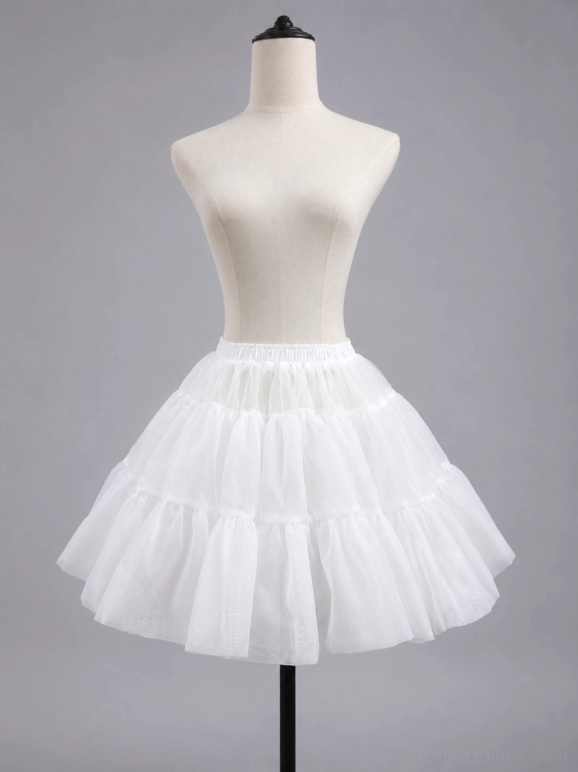 White high-volume sugar puff petticoat front view on dress form mannequin showing tiered ruffled fluffy A-line silhouette with elastic waistband