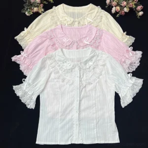 Summer cotton Lolita blouses flat lay display showing three colorway options with Peter Pan collars and ruffled lace sleeves on black background with pink flowers