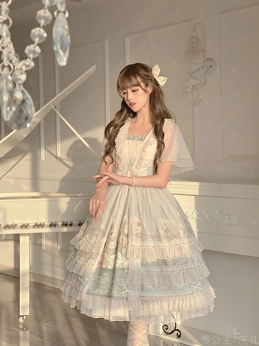 Sunflower themed lolita JSK dress full-body back standing view on model in bright piano studio displaying layered tulle skirt light blue waist trim sheer flutter sleeves