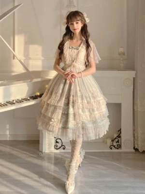 Sunflower printed lolita JSK dress full-body front view on model wearing cream tiered ruffle skirt with sheer flutter sleeves in vintage white piano room