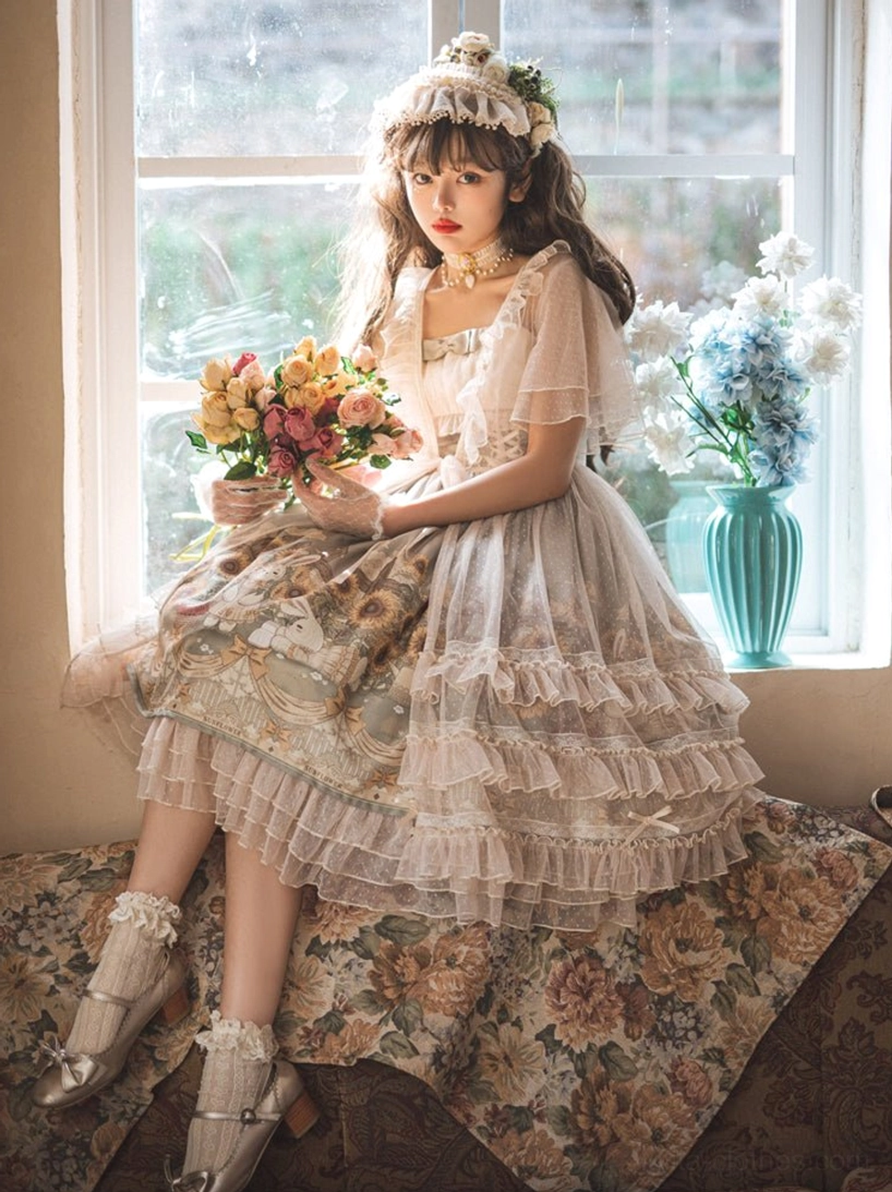 Sunflower lolita jumper skirt half-body sitting shot on model on floral sofa by vintage window displaying oil painting style printed skirt with ruffled tulle layers